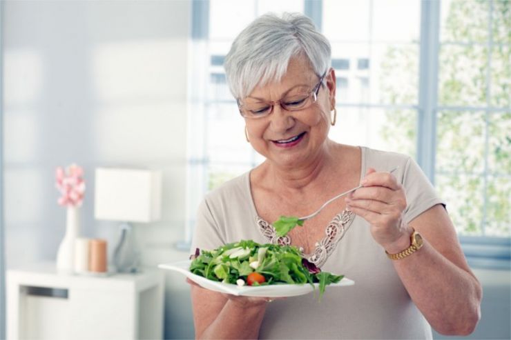 Elderly woman eating healthy